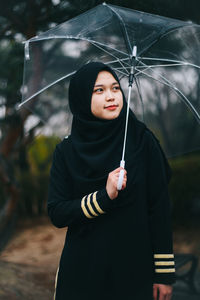 Woman holding umbrella