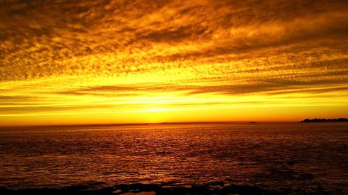 Scenic view of sea at sunset