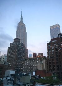 Skyscrapers in city against sky