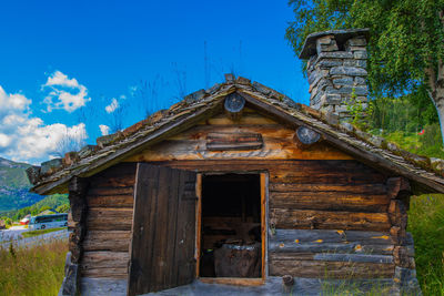 Low angle view of abandoned building against sky