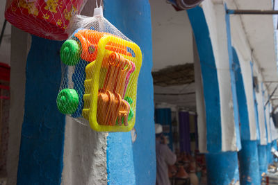 Close-up of multi colored decorations hanging at market stall