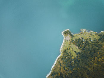 Low angle view of rock formation against clear blue sky