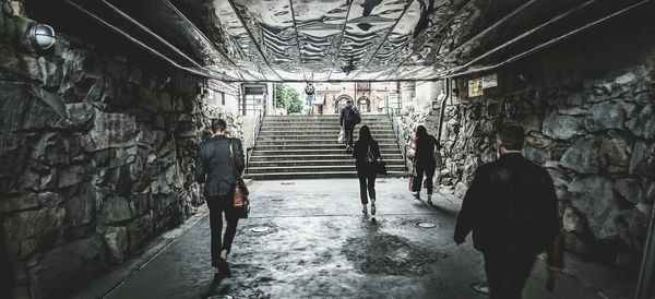 People walking in tunnel