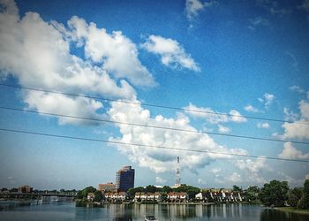 View of city against cloudy sky