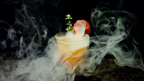 Moment of cocktail in smoke