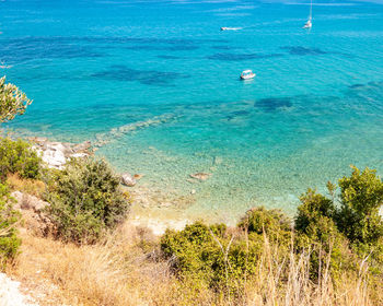 High angle view of sailboats on sea shore