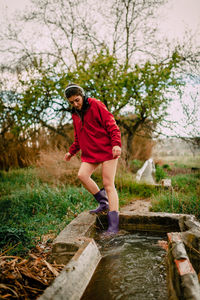 Woman standing by water