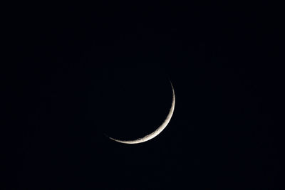 Low angle view of moon against sky at night