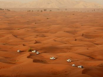 High angle view of sport utility vehicles at desert