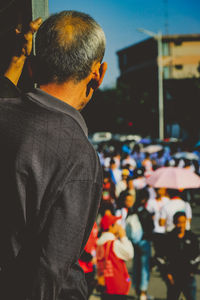 Rear view of man standing on street