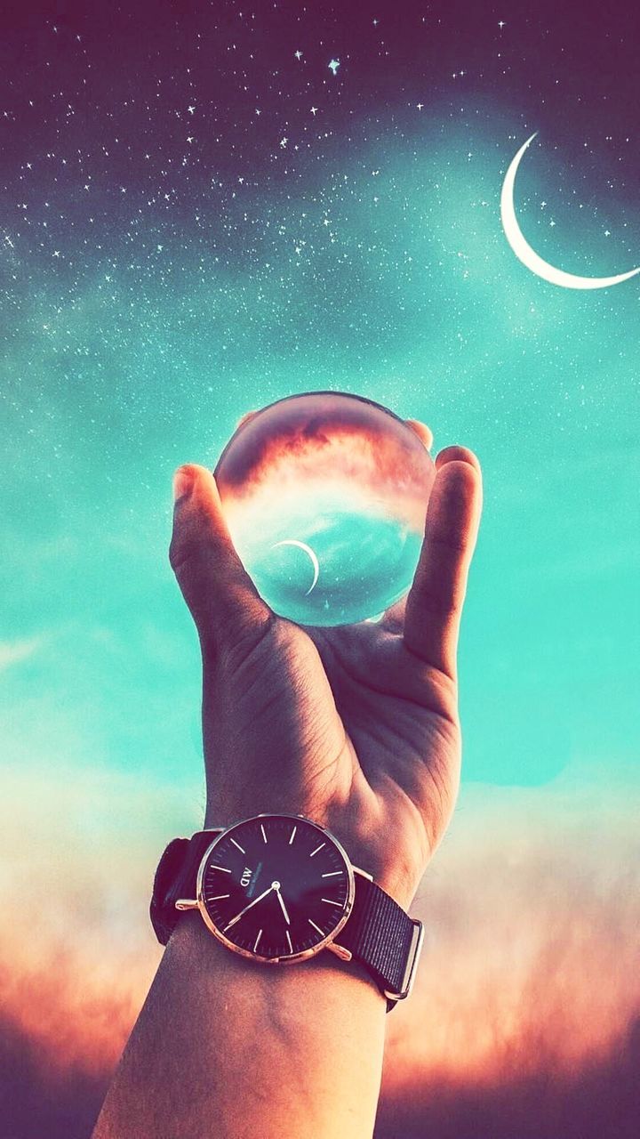 human hand, hand, human body part, one person, real people, human finger, body part, finger, sky, holding, personal perspective, unrecognizable person, nature, lifestyles, star - space, focus on foreground, watch, cloud - sky, space, outdoors, astronomy, digital composite