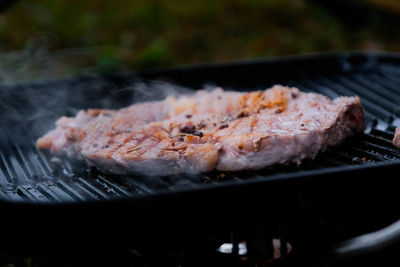 Close-up of meat on barbecue grill