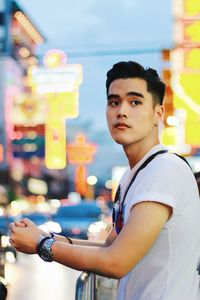 Portrait of young man standing outdoors