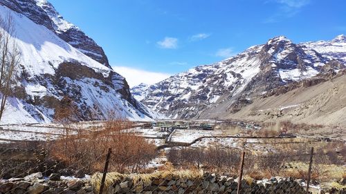 Scenic view of snowcapped mountains against sky