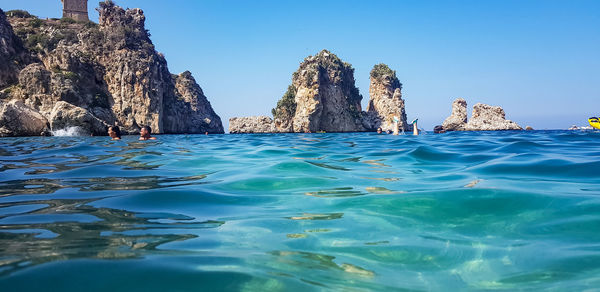 Scenic view of sea against clear blue sky