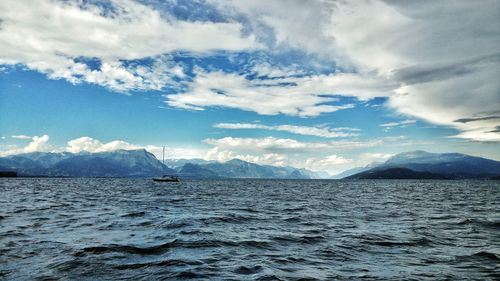 Scenic view of sea against cloudy sky