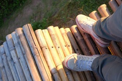 Low section of man on wooden floor