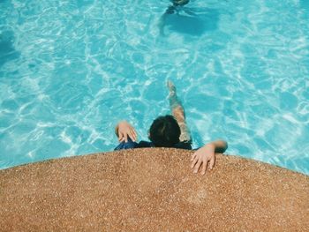 High angle view of man swimming in pool