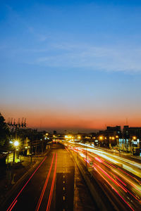 High angle view of light trails on highway at night