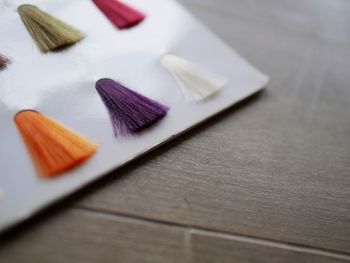 High angle view of hair color swatches on table