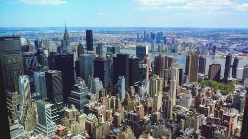 Aerial view of modern buildings in city against sky