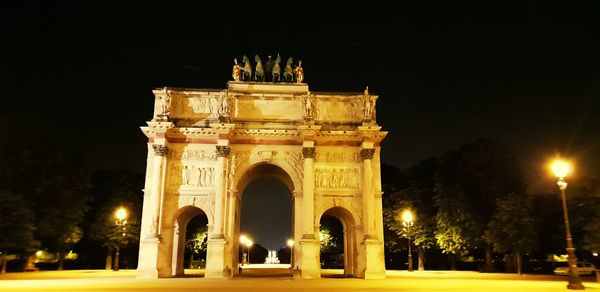 Low angle view of historical building at night