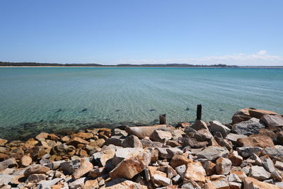 Scenic view of sea against clear blue sky