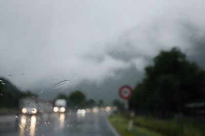 Traffic on road seen through car windshield