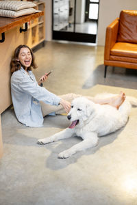 Woman with dog at home