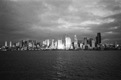 Panoramic view of sea and buildings against sky