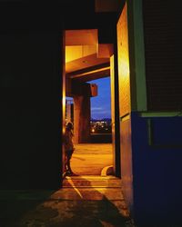 Man walking in illuminated building