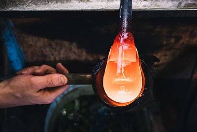 Manual worker making glass at workshop