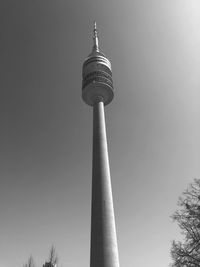 Low angle view of communications tower against sky