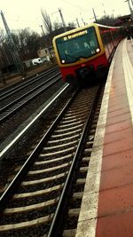 Train at railroad station against sky