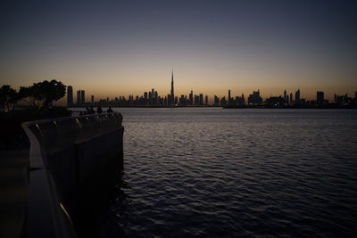 Dubai skyline from dubai creek harbour and dubai canal to downtown and business bay, uae
