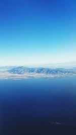 Scenic view of calm sea against clear sky