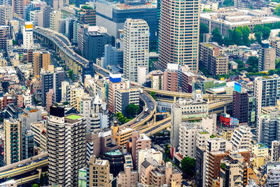 High angle view of street amidst buildings in city