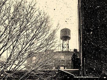 Low angle view of water tower against sky