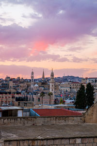 Cityscape against sky during sunset