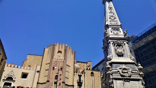 Low angle view of building against blue sky