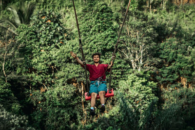 Full length of senior man in forest