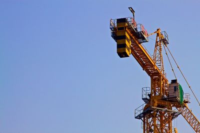 Low angle view of built structure against clear blue sky