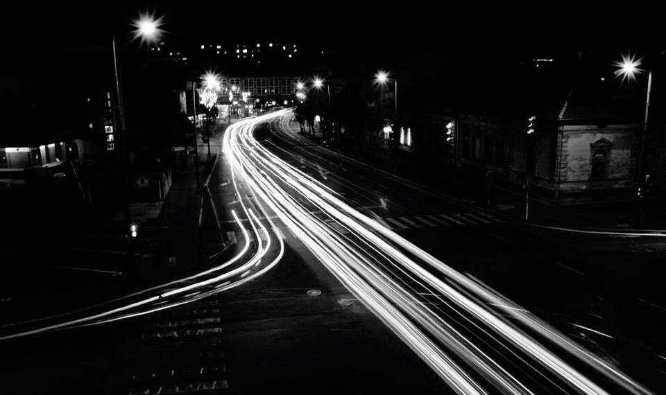 illuminated, night, light trail, long exposure, motion, transportation, road, street light, speed, city, lighting equipment, street, high angle view, on the move, blurred motion, city life, car, rush hour, tail light, mode of transport, city street, the way forward, outdoors, vehicle light, diminishing perspective, journey