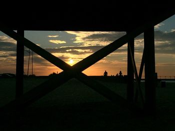 Silhouette landscape against sky during sunset