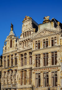 Low angle view of building against blue sky