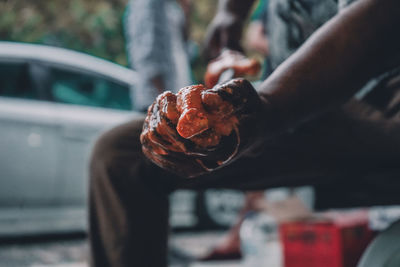 Close-up of hand holding ice cream