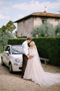 Rear view of couple holding hands