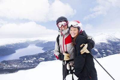 Portrait of smiling couple skiing
