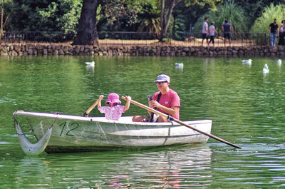 Man kayaking in lake