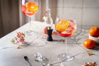 Fruits in glass on table